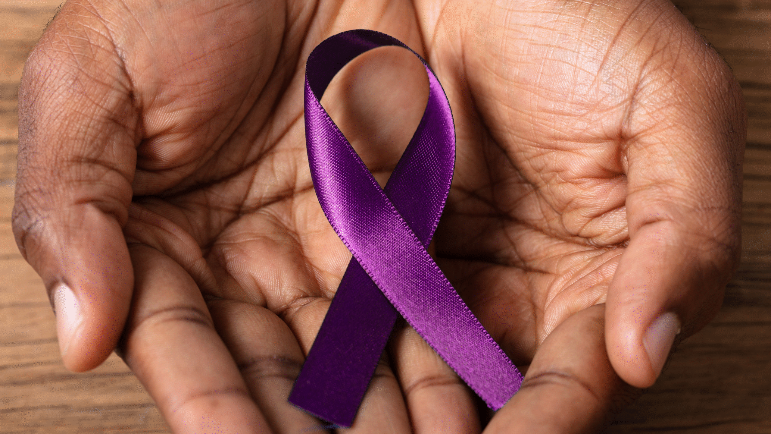 person with purple flag in support of Overdose Awareness Day
